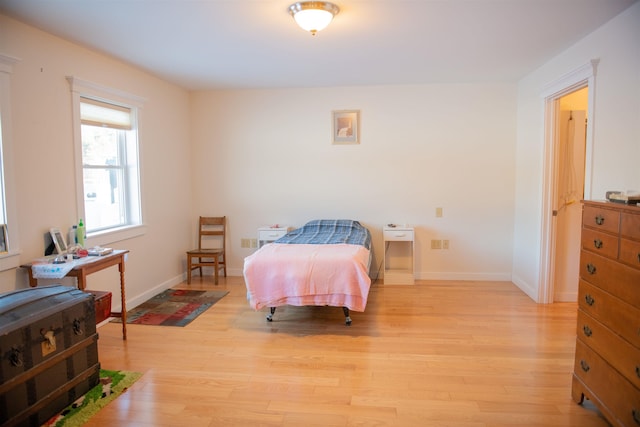 bedroom with light hardwood / wood-style floors