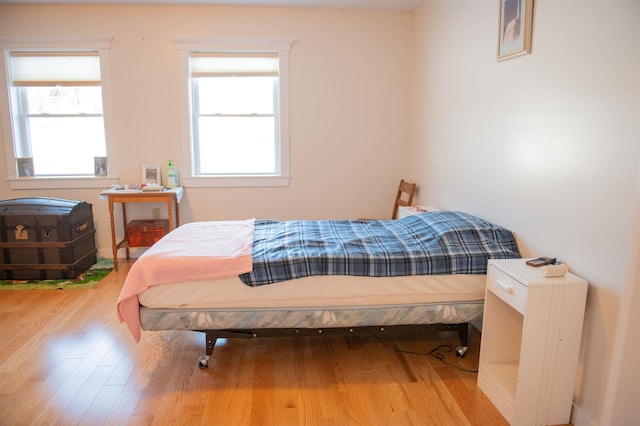 bedroom with wood-type flooring