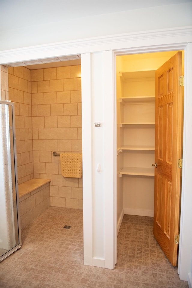 interior space with a tile shower