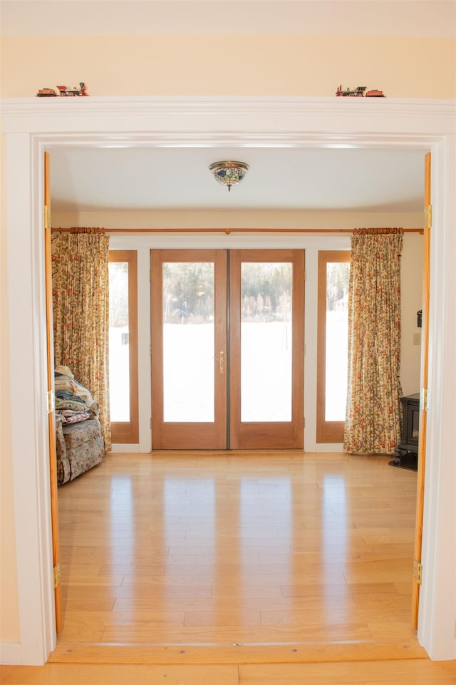 interior space with french doors and wood-type flooring