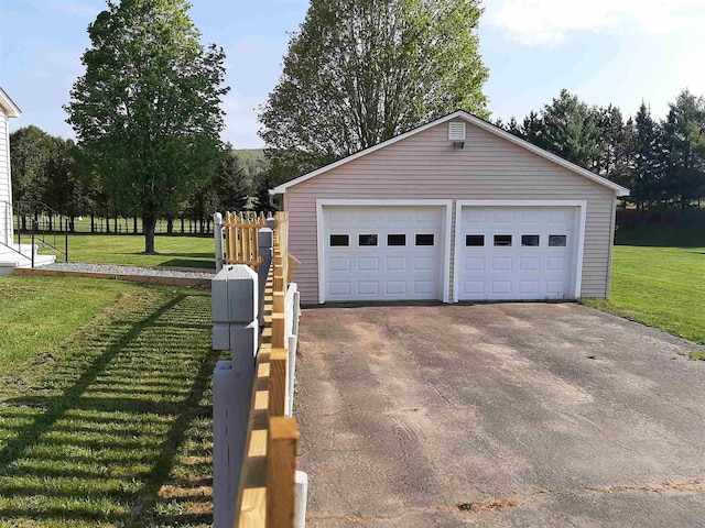 garage with a lawn