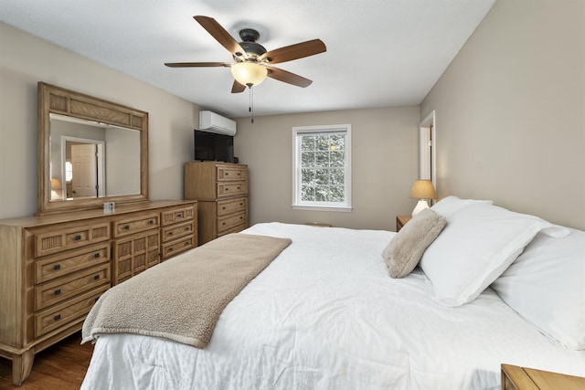 bedroom with dark wood-type flooring, a wall mounted air conditioner, and ceiling fan