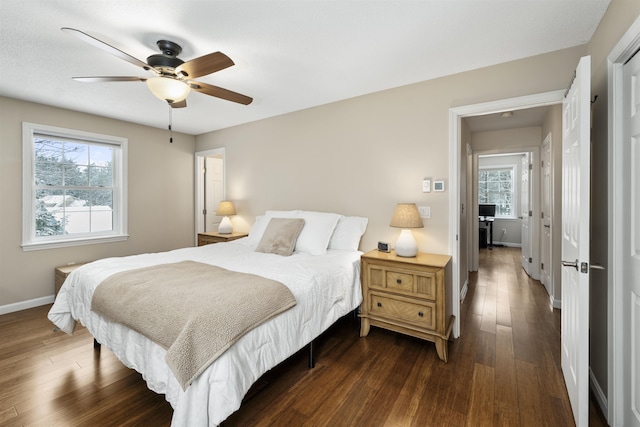 bedroom with dark wood-type flooring and ceiling fan