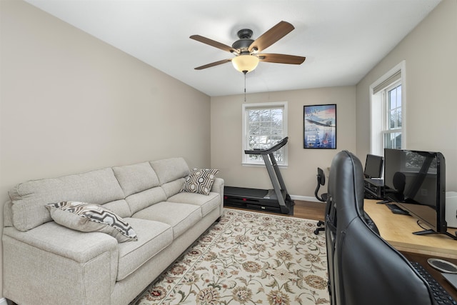 office with hardwood / wood-style flooring and ceiling fan