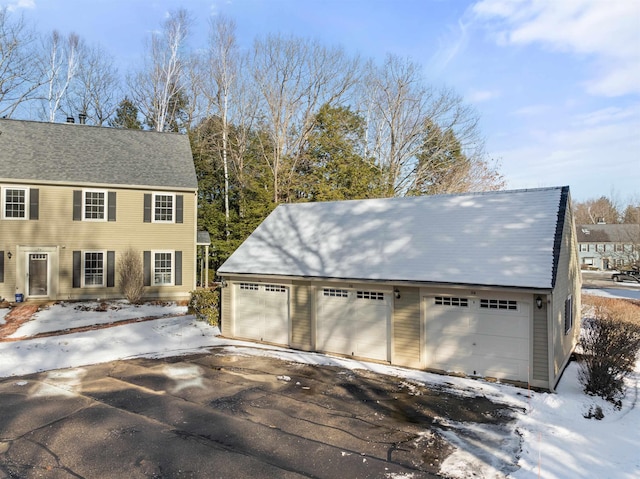 view of snow covered garage