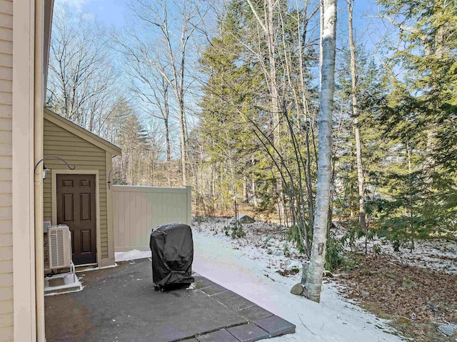 snow covered patio with central AC