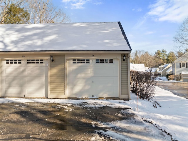 view of snow covered garage