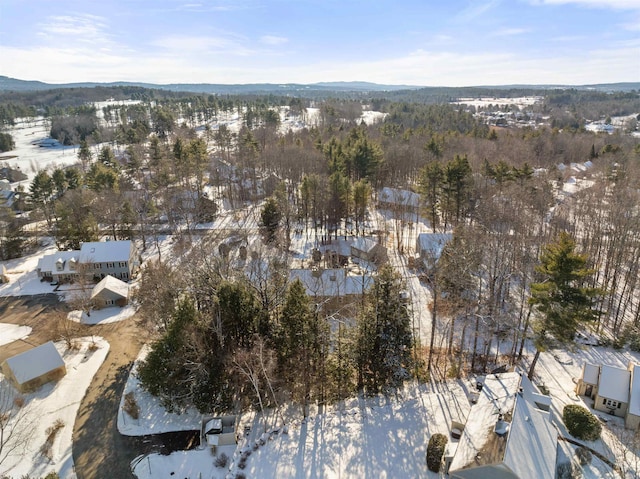 snowy aerial view with a mountain view