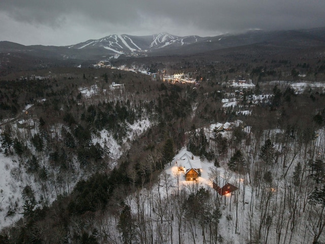 snowy aerial view with a mountain view