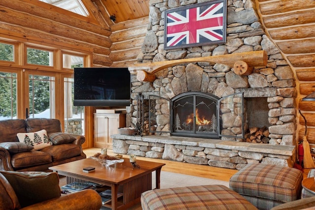 living room featuring wood-type flooring, plenty of natural light, log walls, and a fireplace