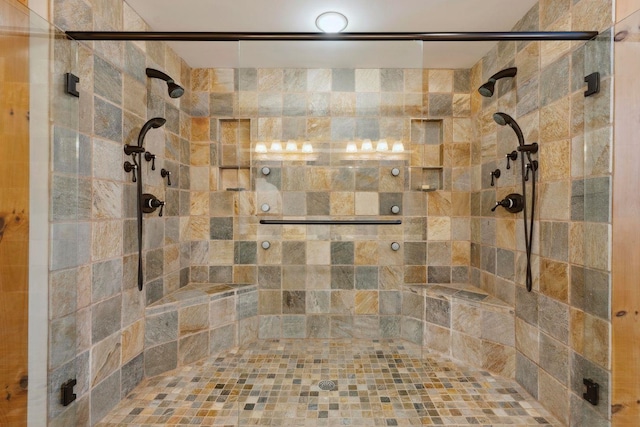 bathroom featuring tiled shower