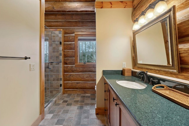 bathroom with vanity, log walls, and walk in shower