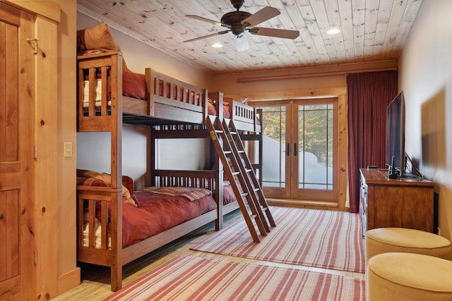 carpeted bedroom featuring wood ceiling and french doors