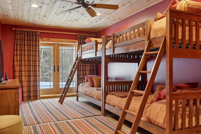 bedroom with carpet floors, wooden ceiling, and french doors