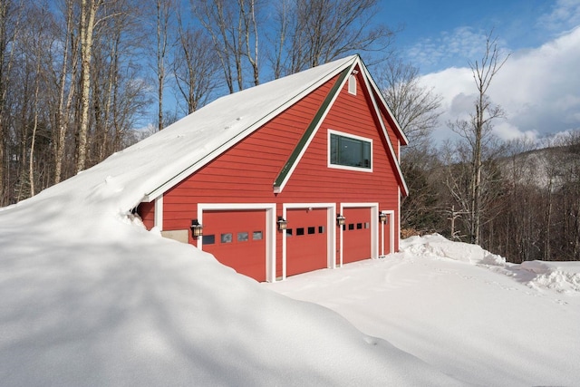 view of snow covered garage