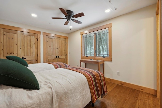 bedroom with hardwood / wood-style floors and ceiling fan