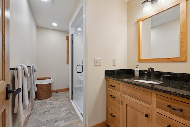 bathroom with vanity and an enclosed shower