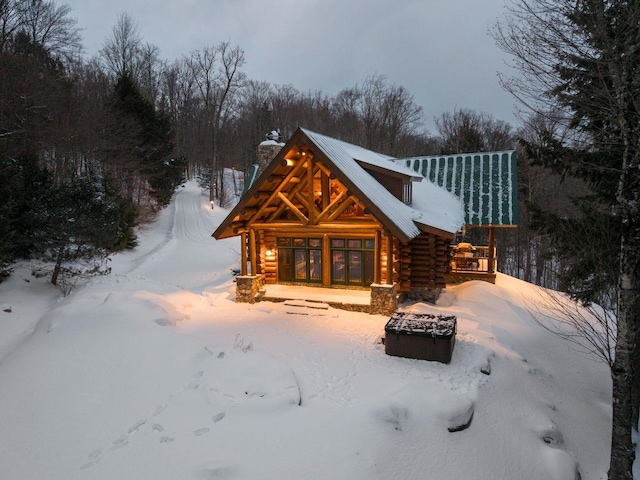 view of snow covered house