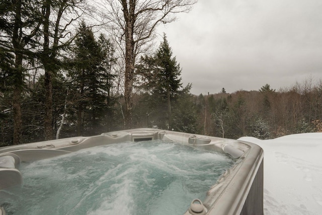 exterior space with a hot tub