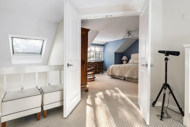 carpeted bedroom with ceiling fan and lofted ceiling