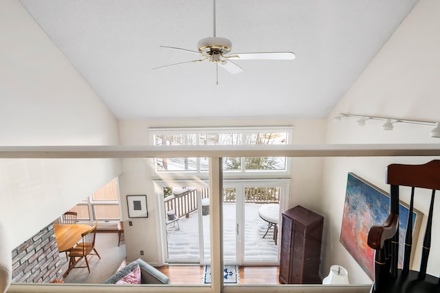 doorway to outside featuring vaulted ceiling and ceiling fan