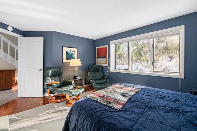 bedroom with hardwood / wood-style flooring