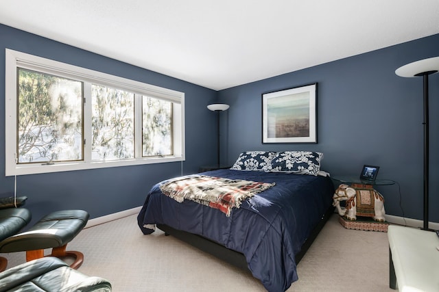 bedroom with light colored carpet