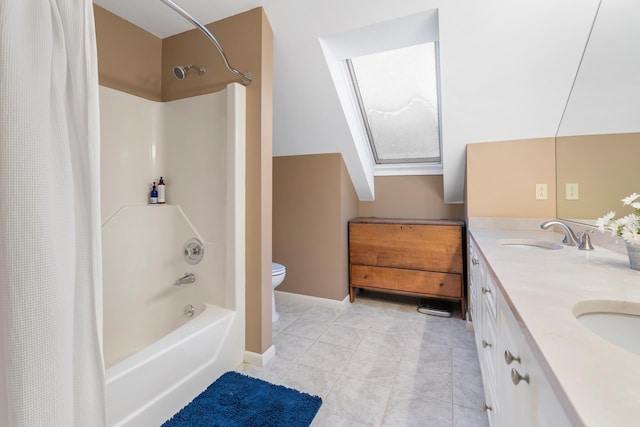 full bathroom with vanity, shower / tub combo, tile patterned floors, and toilet