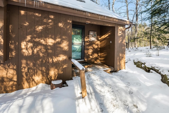 view of snow covered property entrance