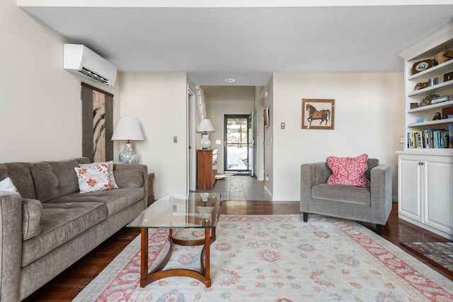 living room featuring a wall mounted air conditioner and dark hardwood / wood-style flooring