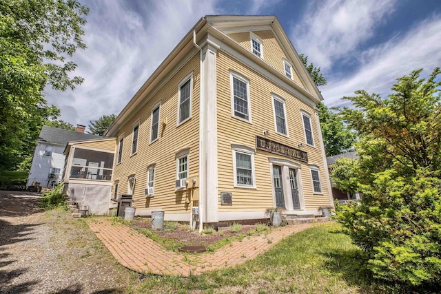 view of home's exterior featuring a sunroom