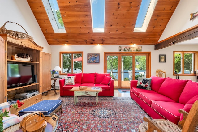 living room with high vaulted ceiling, a wealth of natural light, a skylight, and wooden ceiling