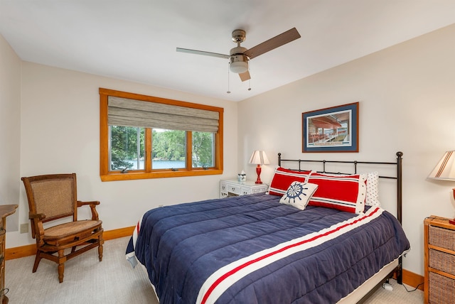 bedroom with light colored carpet and ceiling fan