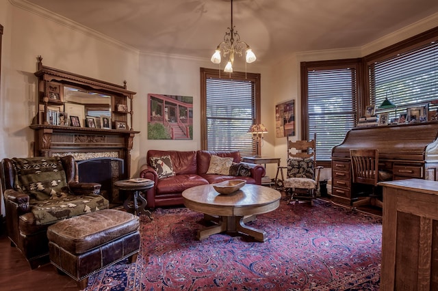 living area with hardwood / wood-style flooring, crown molding, and an inviting chandelier