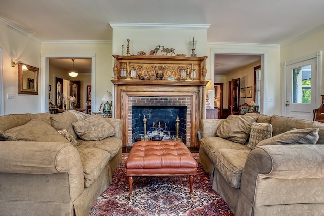 living room with a fireplace and ornamental molding