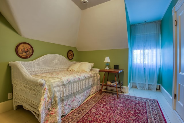 bedroom with lofted ceiling