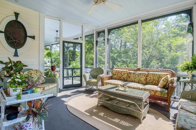 sunroom featuring ceiling fan