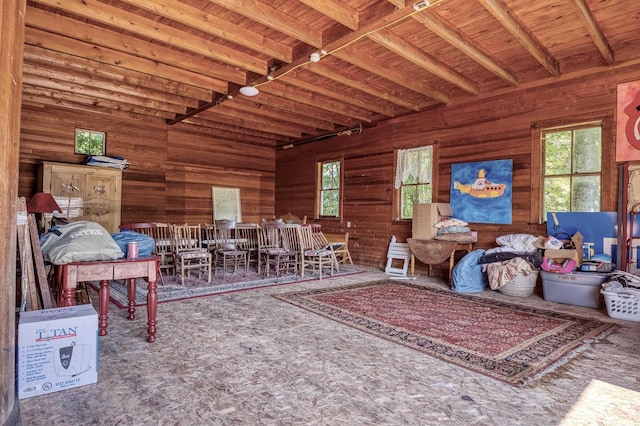 miscellaneous room featuring beam ceiling, wooden walls, and wooden ceiling