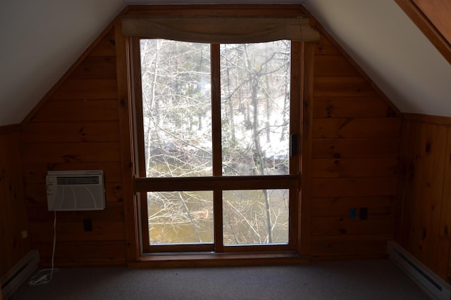 additional living space with vaulted ceiling, an AC wall unit, a baseboard heating unit, and wooden walls