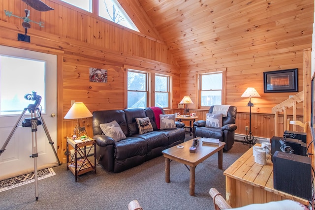 carpeted living room featuring wood walls, wooden ceiling, high vaulted ceiling, and a wealth of natural light