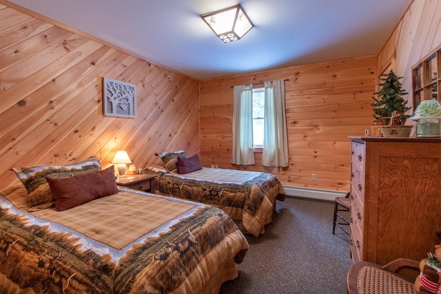 bedroom featuring a baseboard heating unit, dark carpet, and wooden walls