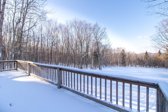 view of snow covered deck