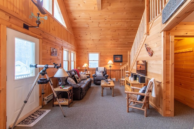 carpeted living room featuring a wealth of natural light, high vaulted ceiling, and wood walls