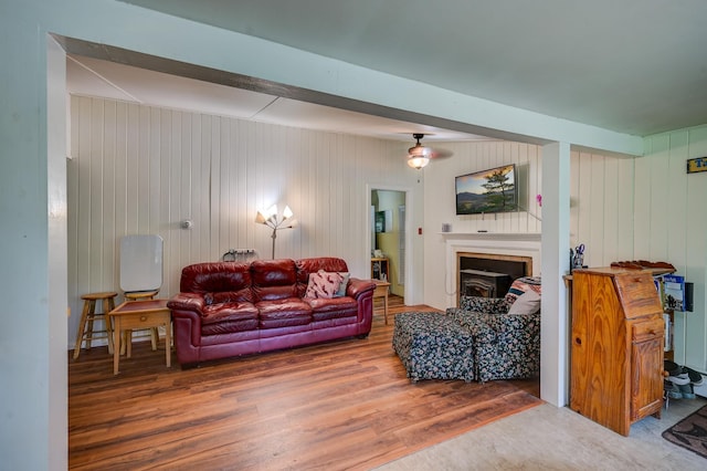 living room featuring beamed ceiling and hardwood / wood-style floors