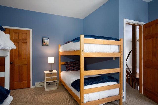 bedroom featuring lofted ceiling and carpet flooring