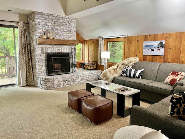 carpeted living room featuring a brick fireplace, wooden walls, and vaulted ceiling