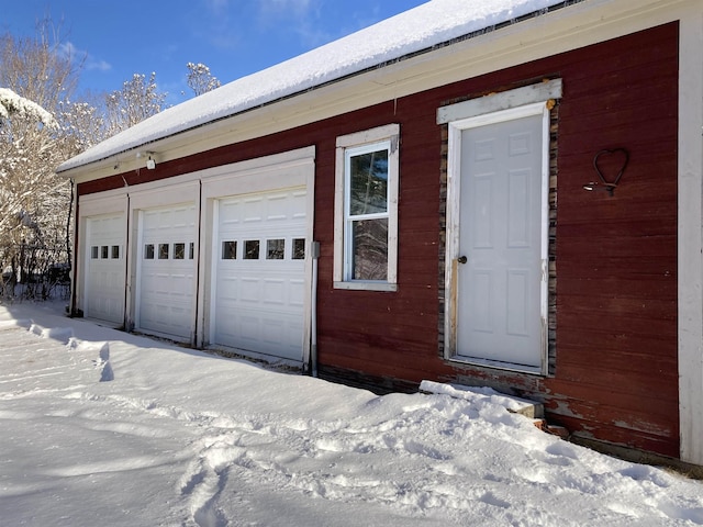 view of snow covered garage