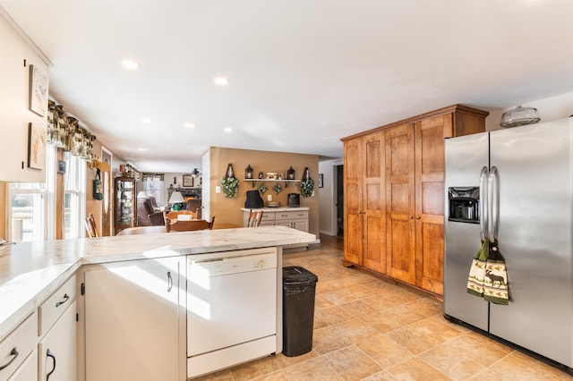 kitchen with dishwasher and stainless steel fridge with ice dispenser