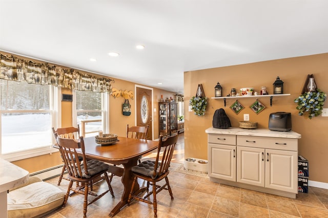 dining area with a baseboard heating unit