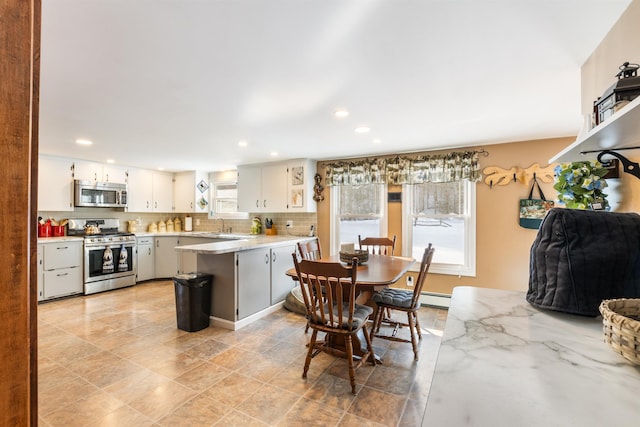 dining area with a baseboard radiator